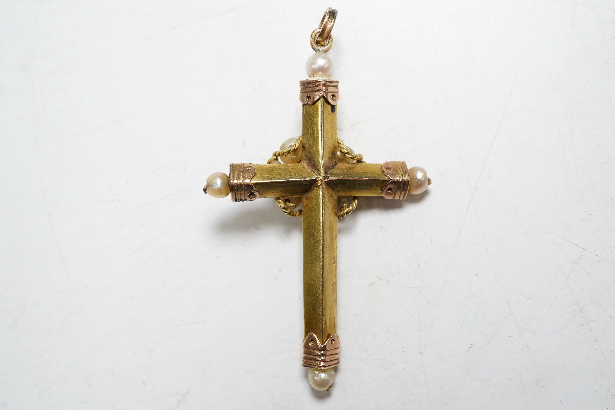 A 19th century Continental gold cross pendant set with an emerald and pearls, 4.5cm, gross 3.6 grams. Condition - good